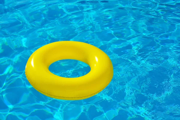 Inflatable tube floating in swimming pool