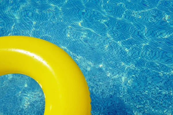 Colorful inflatable tube floating in swimming pool