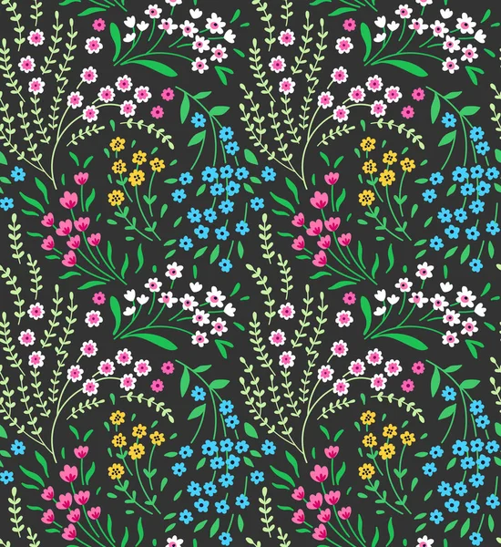 Cute seamless pattern in small flowers