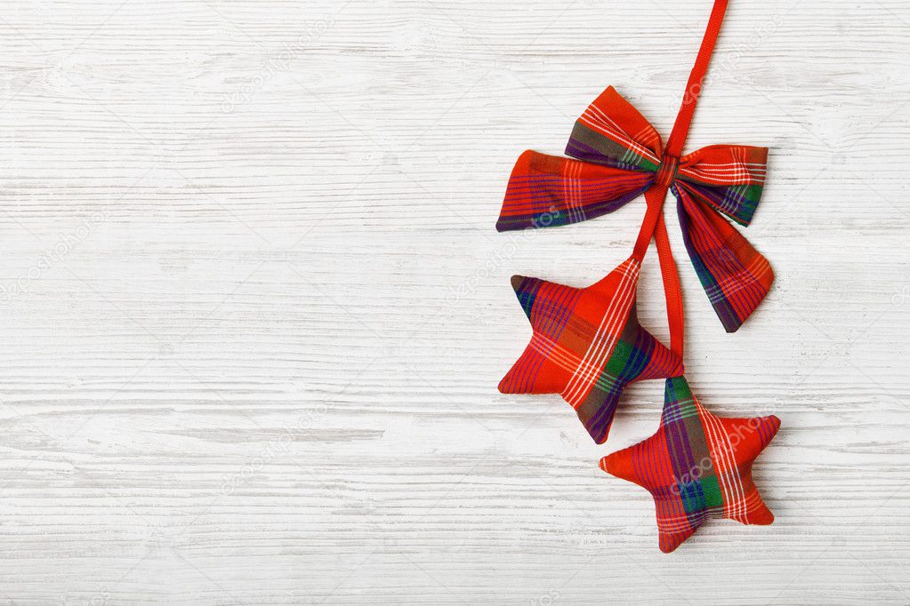 Hanging Star Christmas Decoration on Wood White Plank Background