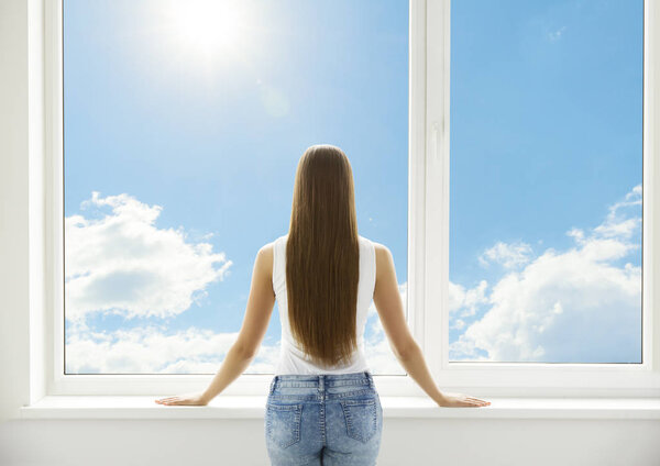 Window and Woman, Back View of Young Girl Standing in White Home Interior, Human Looking through PVC Window