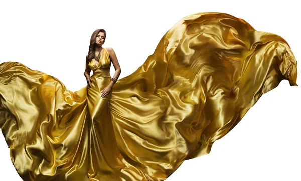 Fashion Model gouden jurk, elegante vrouw in fladderende gouden jurk, mooi meisje en zijde stof vliegen vliegen — Stockfoto