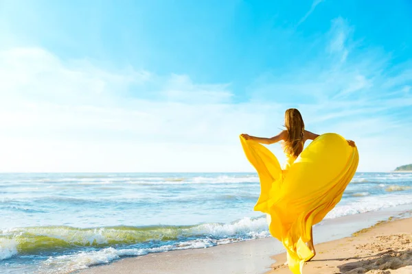 Woman Sunny Sea Beach Yellow Fluttering Dress Fashion Model Back — стокове фото