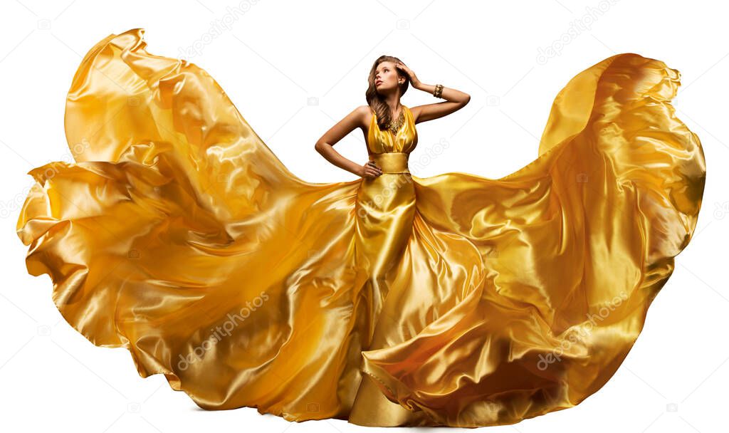 Woman in Fluttering Gold Dress on White, Waving Silk Cloth, Artistic Fashion Model in Golden Color Fabric