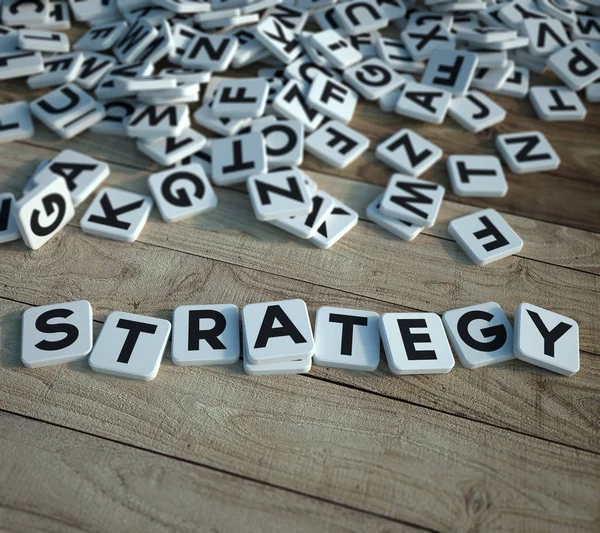 Strategy in letter tiles on wood — Stockfoto