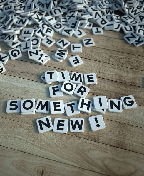 Time for something new in letter tiles wood — Stock Photo, Image