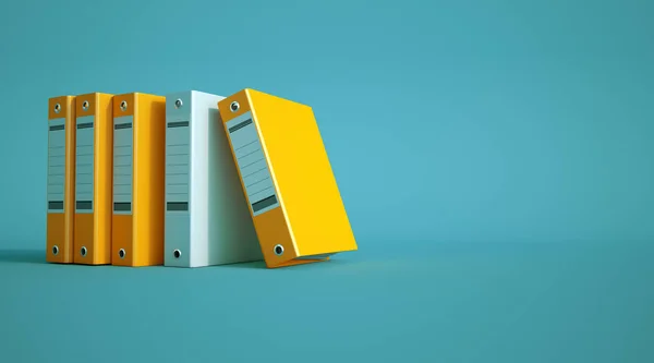 Yellow and gray ring binders on a blue background — Stock Photo, Image