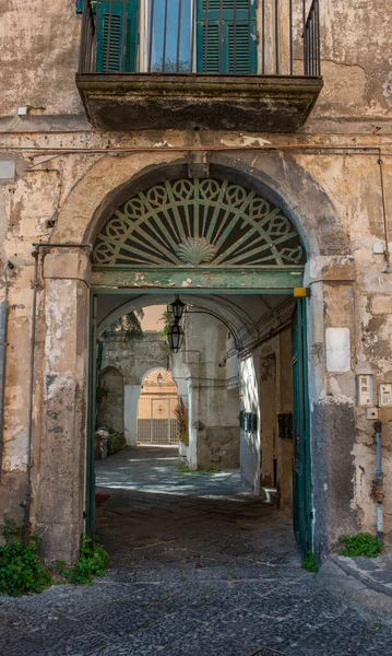 Ancient building entrance in Naples, Italy