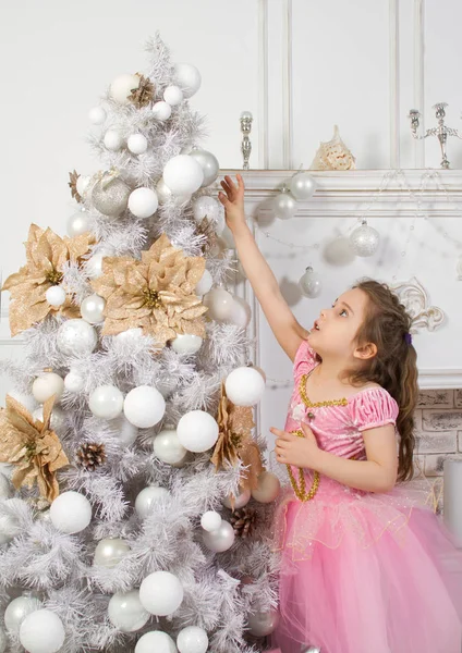 Little Girl Pink Dress Princess Hangs Ball Christmas Tree — Stock Photo, Image