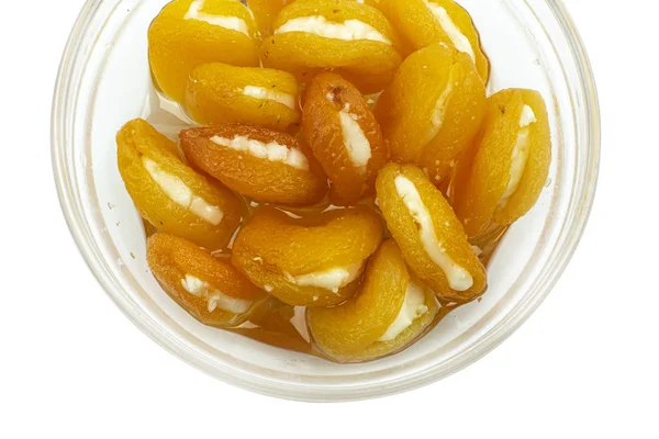 Isolated dried apricots with cheese on white background with clipping path