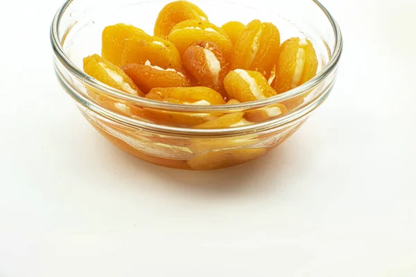 Isolated dried apricots with cheese on white background with clipping path