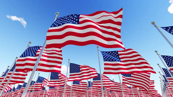 Flags of USA against blue sky. — Stock Photo, Image