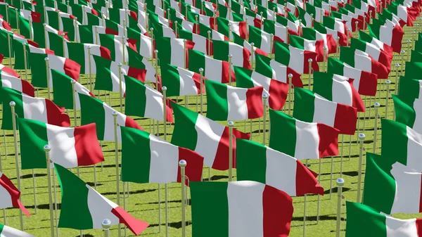 Mnoho příznaků z Itálie vlající ve větru v zeleném poli. — Stock fotografie