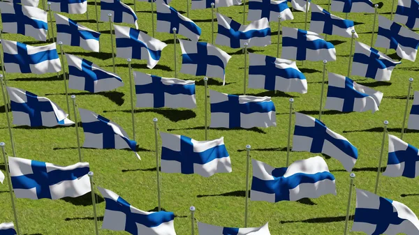 Finland leeuwenvlaggetjes op vlaggenmasten in groene veld — Stockfoto