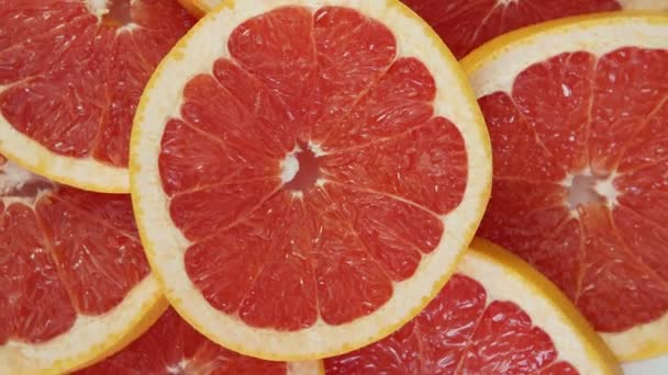 Gesneden grapefruit achtergrond — Stockvideo