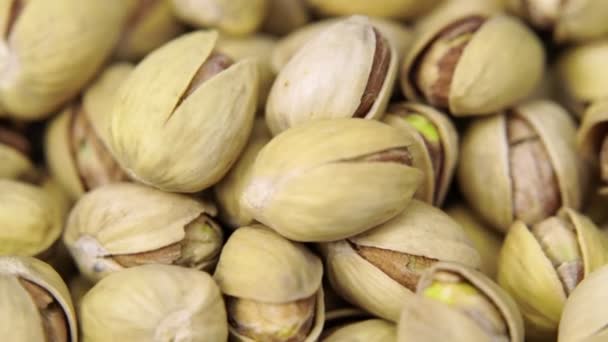 Roasted and salted pistachios background — Stock Video