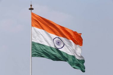 state flag of India on flagpole at Connaught Place in Delhi clipart