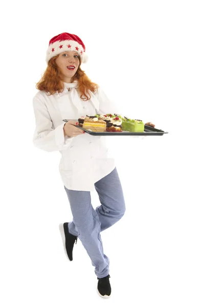 Female baker chef with hat of Santa Claus dancing with Christmas — Stock Photo, Image