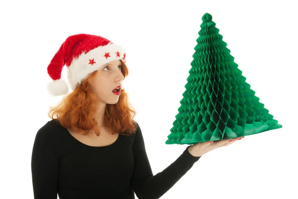 Christmas tree by an young woman — Stock Photo, Image