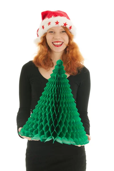 Christmas tree by an young woman — Stock Photo, Image