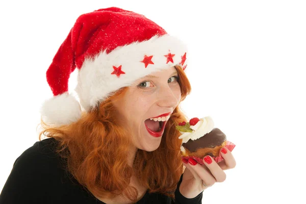 Christmas girl eating cake — Stock Photo, Image