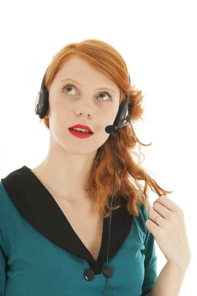 Young red haired woman with head set — Stock Photo, Image