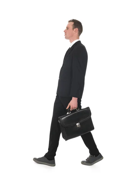 Side view walking business man with briefcase — Stock Photo, Image
