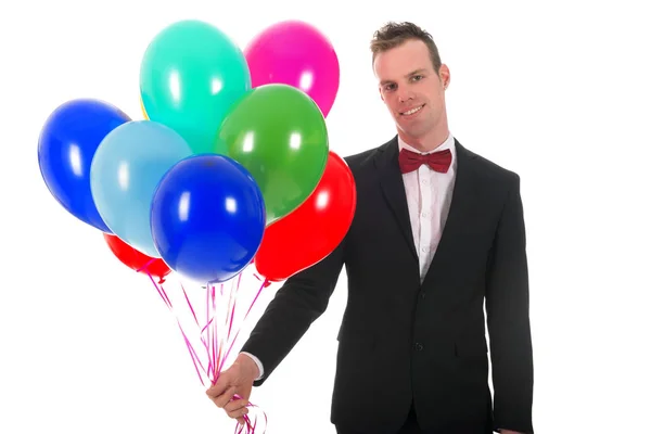 Young man with balloons — Stock Photo, Image