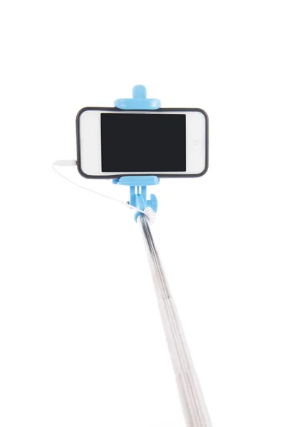 Selfie stick com telefone móvel — Fotografia de Stock