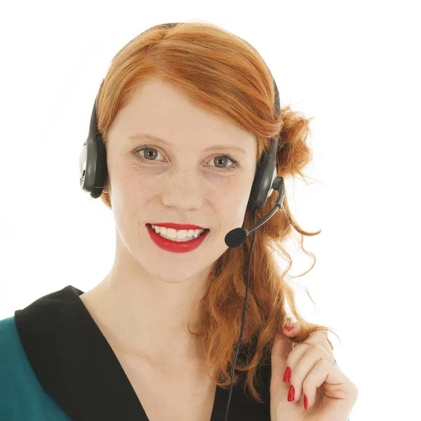 Giovane donna dai capelli rossi con head set — Foto Stock