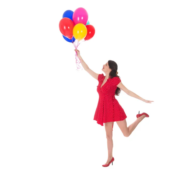 Jonge vrouw vliegen met ballonnen — Stockfoto