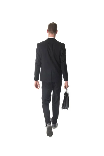 İş adamı evrak çantası ile yürüyüş arkadan görünüm — Stok fotoğraf