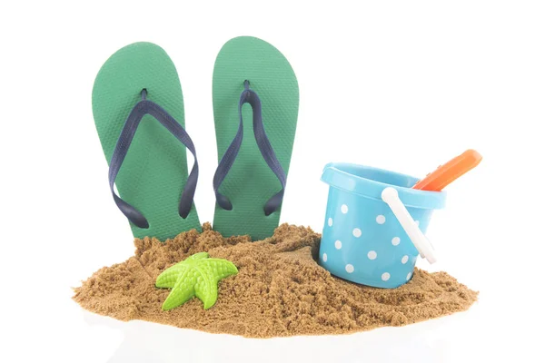 Green flip flops at the beach — Stock Photo, Image
