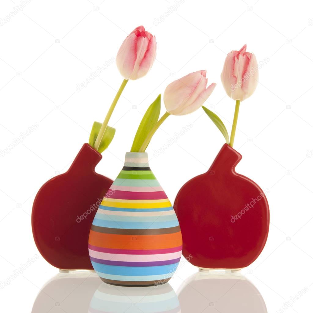 Modern vases with tulips