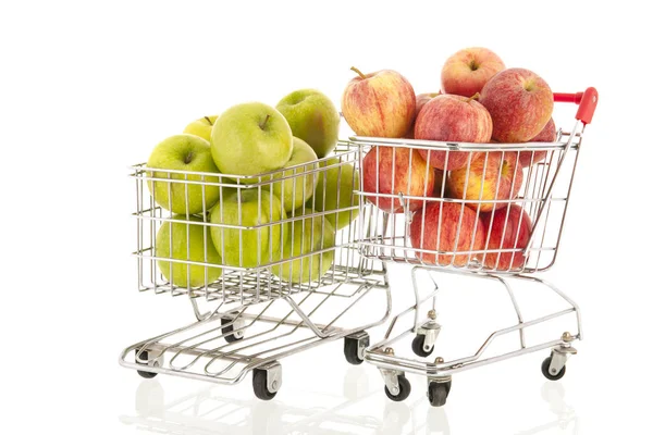 Shopping cart with green and red apples — Stock Photo, Image