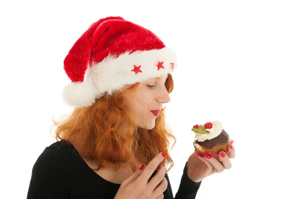 Weihnachtsmädchen essen Kuchen — Stockfoto