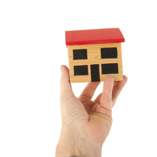 Miniature house in hand — Stock Photo, Image