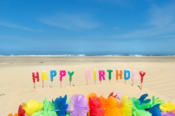 Happy birthday candles at beach — Stock Photo, Image