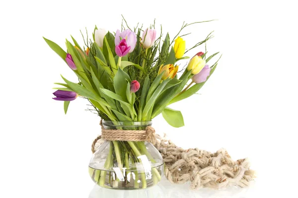 Colorful tulips in glass vase — Stock Photo, Image