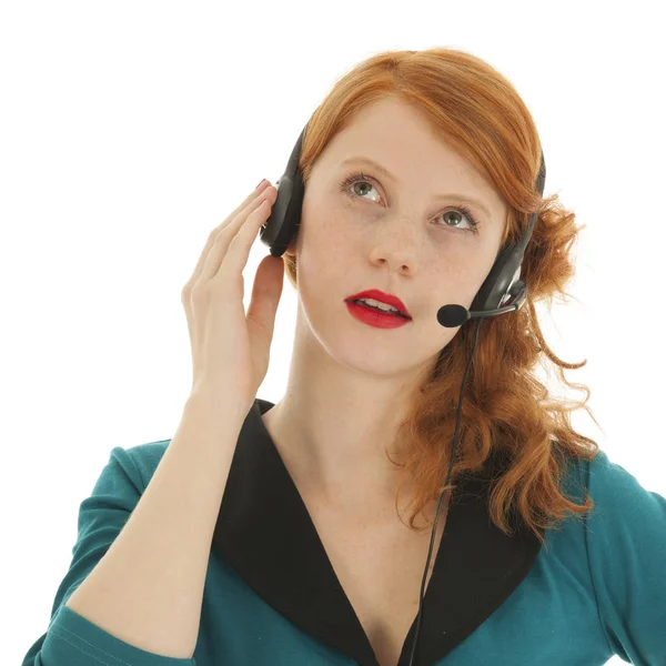 Young red haired woman with head set — Stock Photo, Image