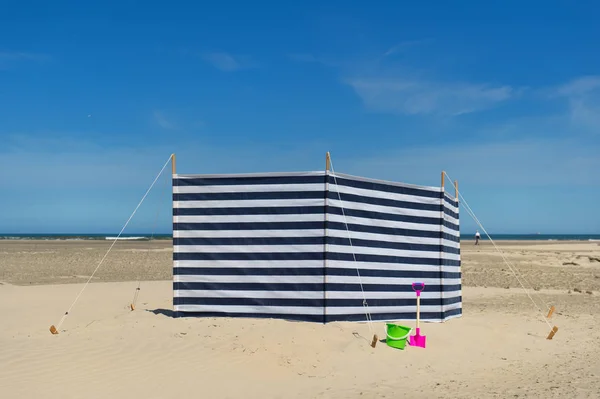 Striped windbreak at the beach — Stock Photo, Image