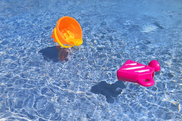 Floating oys in the swimming pool — Stock Photo, Image