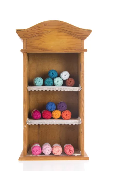 Vintage wooden cabinet with knitting wool — Stock Photo, Image