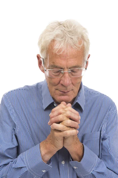 Portrét modlící se staršího muže — Stock fotografie