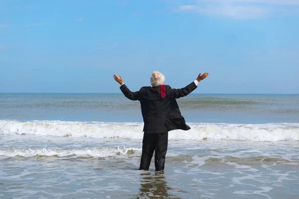 Business man walking in the sea — Stock Photo, Image