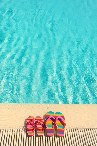 Colorful Striped Flip Flops Swimming Pool — Stock Photo, Image