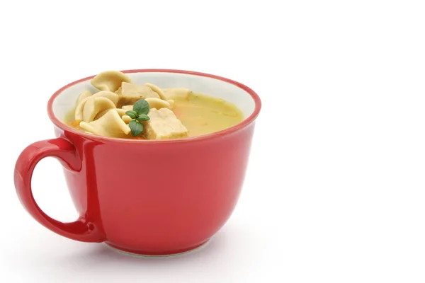 Červený pohár kuřecí polévka — Stock fotografie