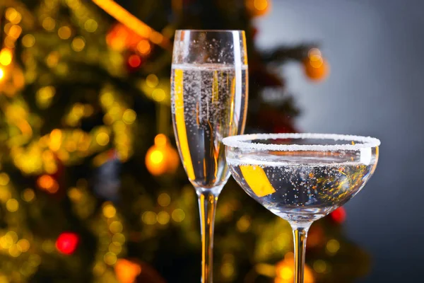 Two glasses with champagne and Christmas ornaments — Stock Photo, Image