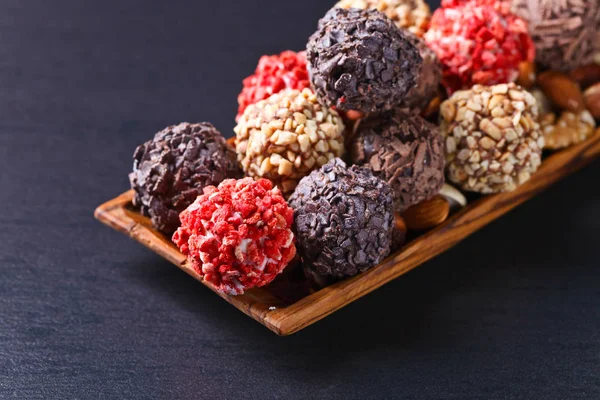 Homemade candy with chocolate , nuts and dried strawberry