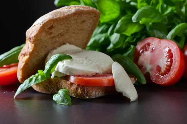 Sandwich with mozzarella, tomato and basil — Stock Photo, Image